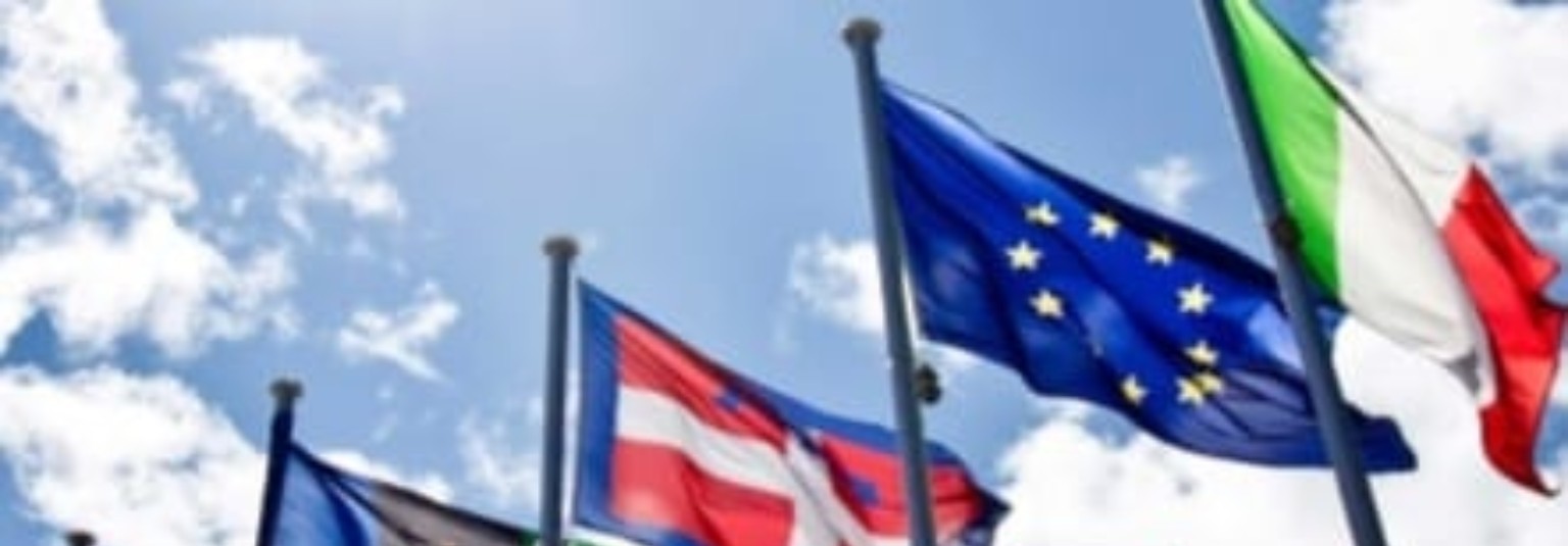 International flags against a blue sky